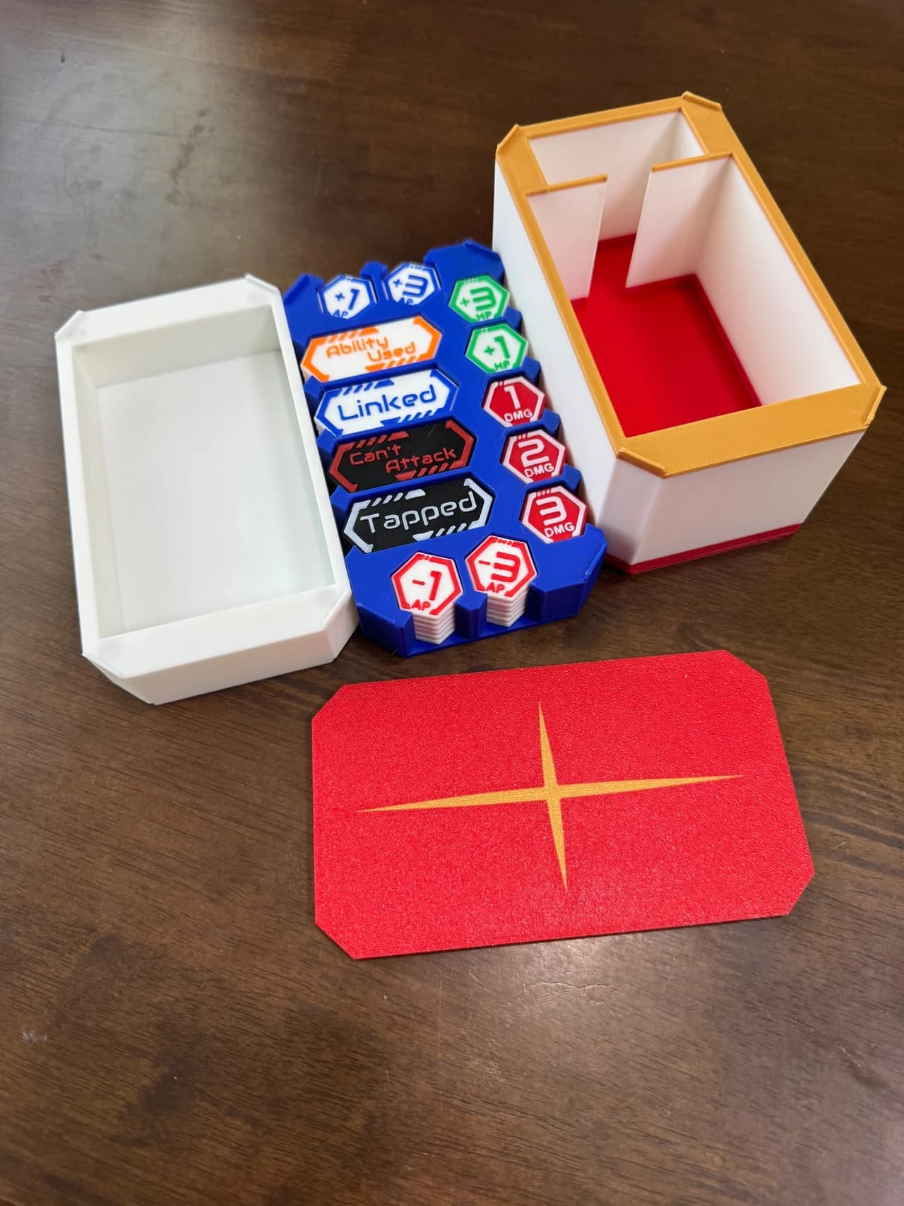 Magnetic stacking trading card game tokens with a fitted storage box