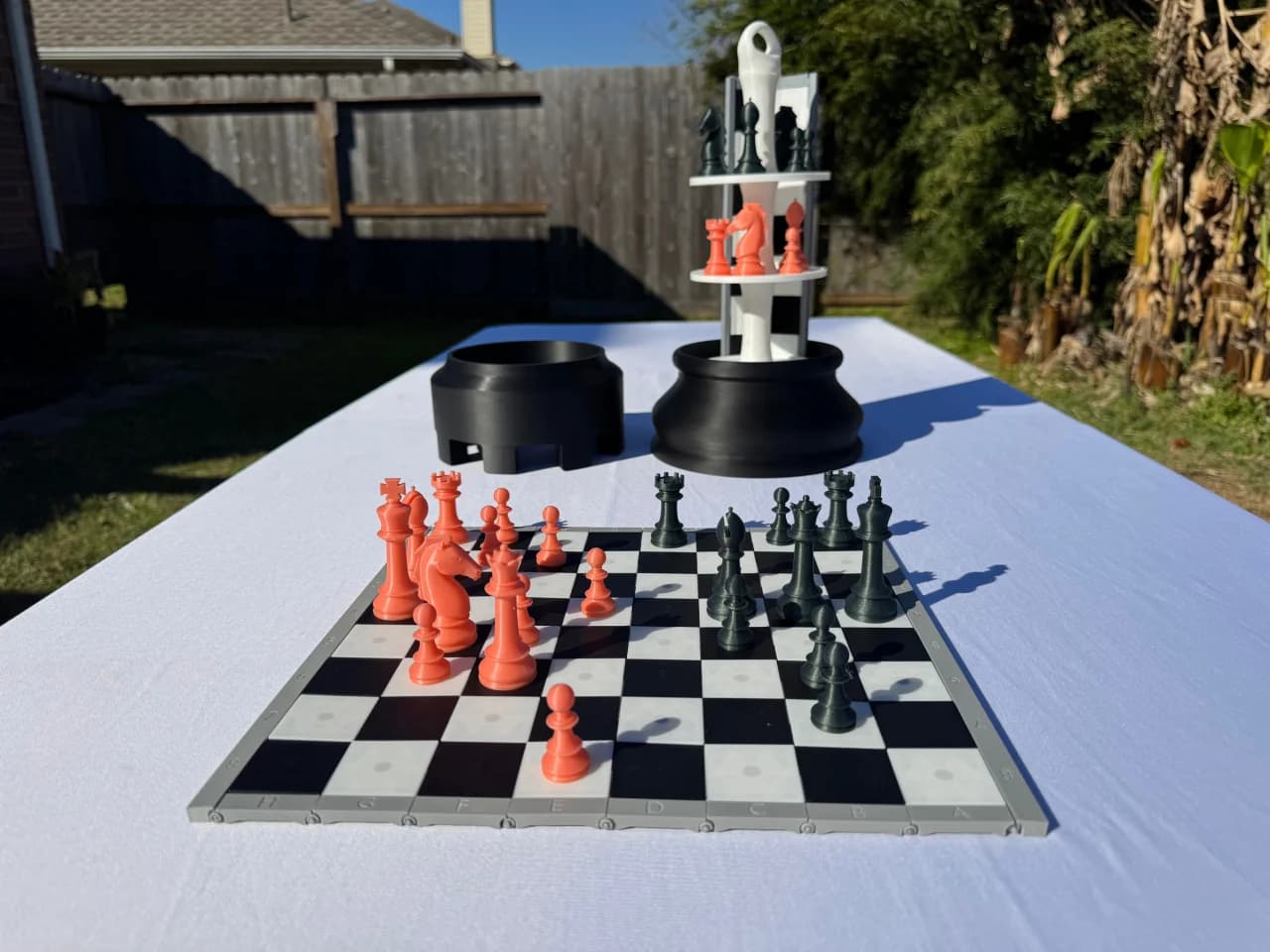 Rook tower chess set displayed behind a chessboard