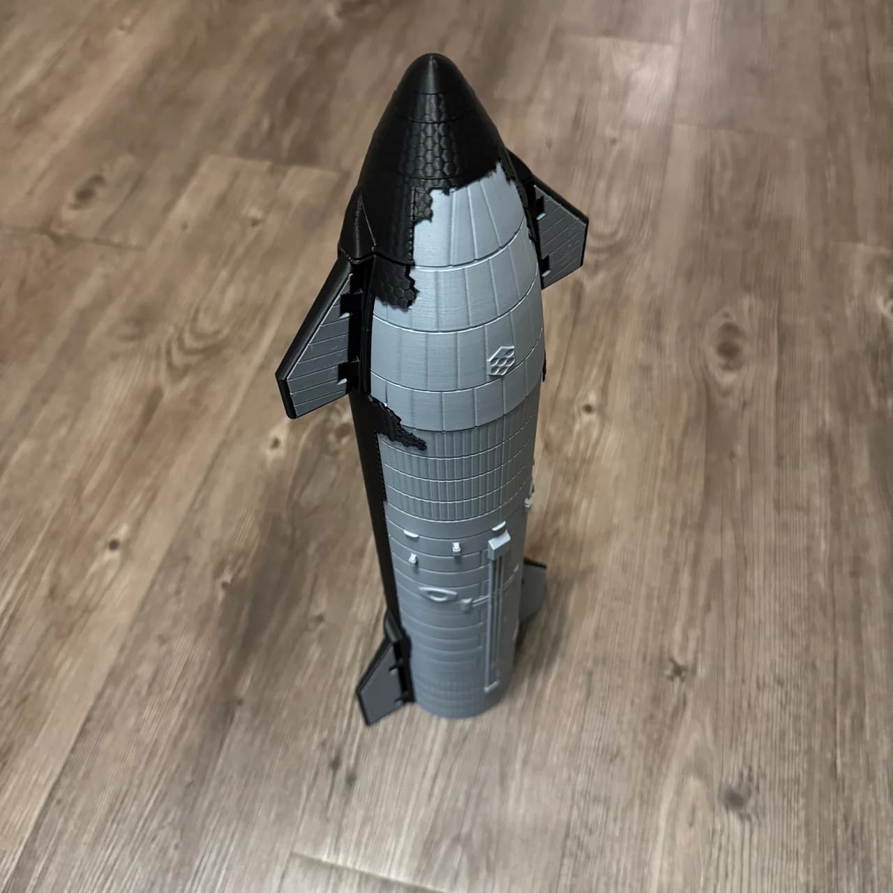 Tall silver and black starship display model